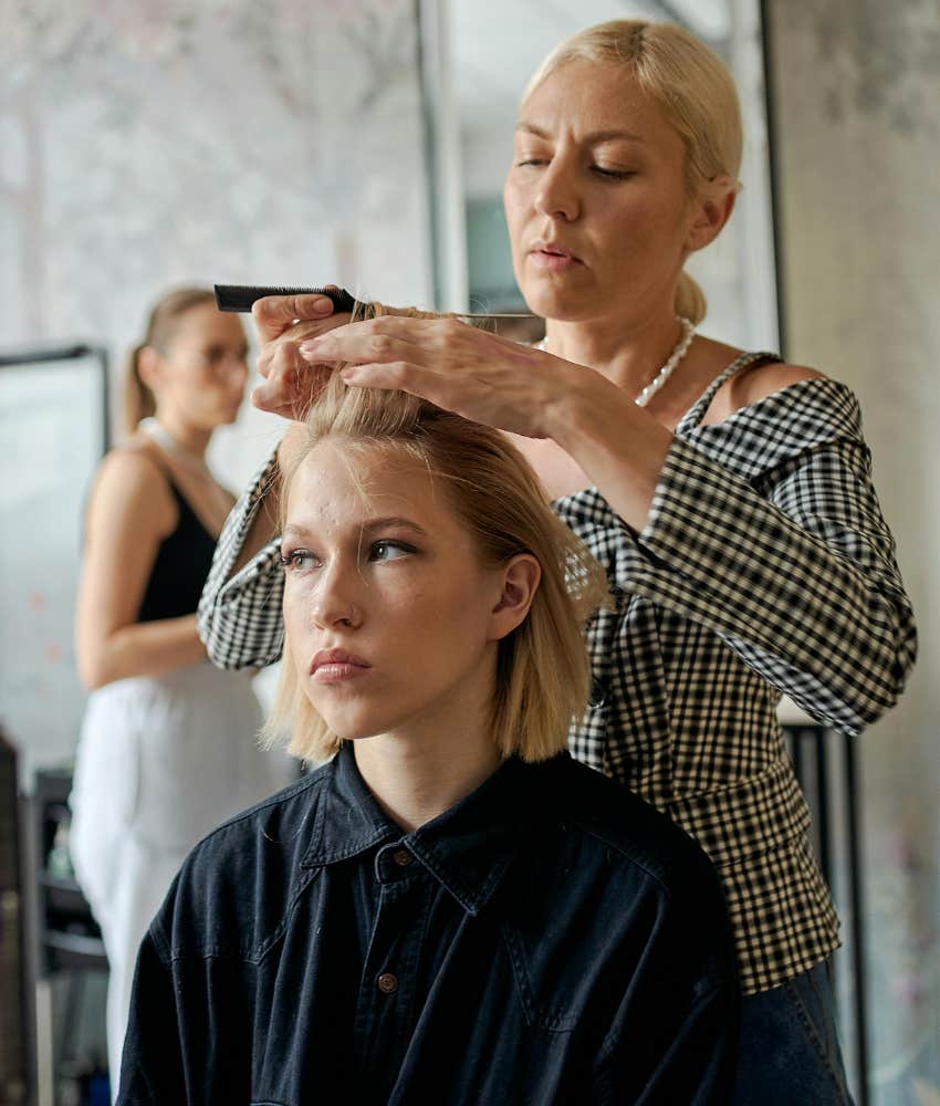 woman getting a haircut 