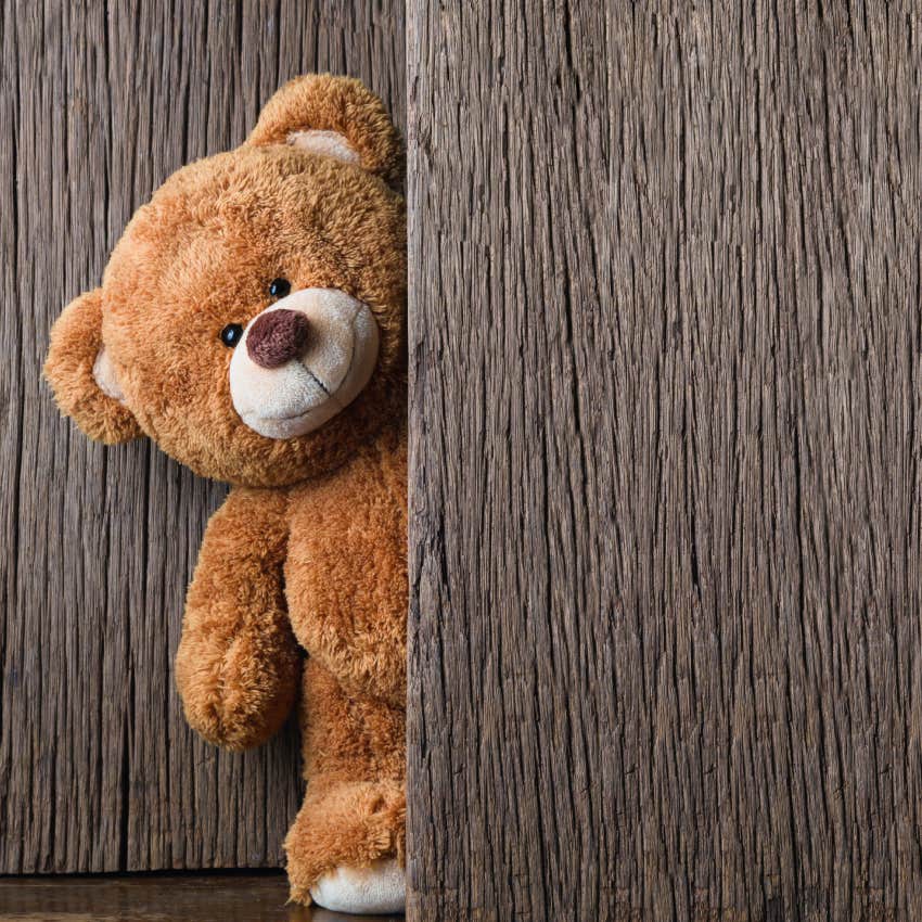 teddy bear on old wood background