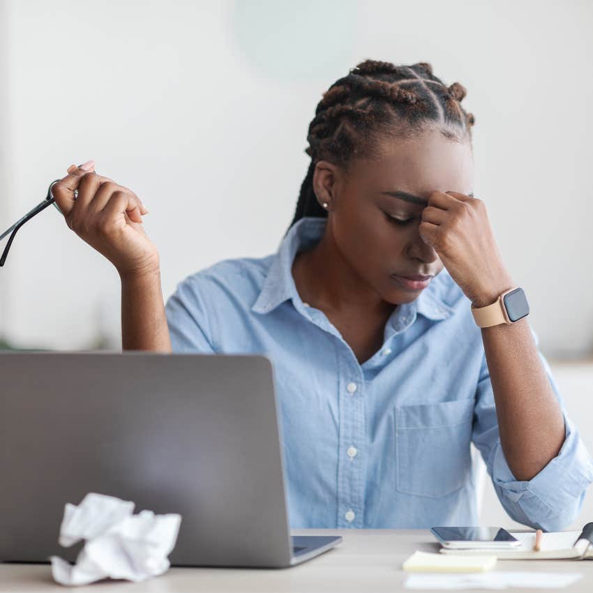 Corporate woman frustrated while working on computer. 