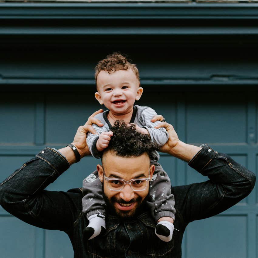 dad with baby on his shoulders 