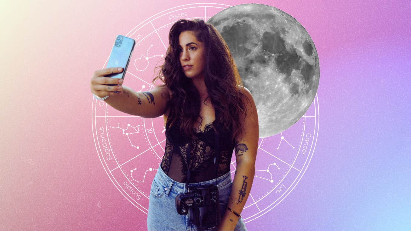 woman taking a selfie before capricorn moon