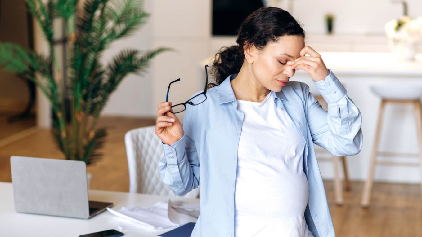 exhausted pregnant mom will a full-time job 