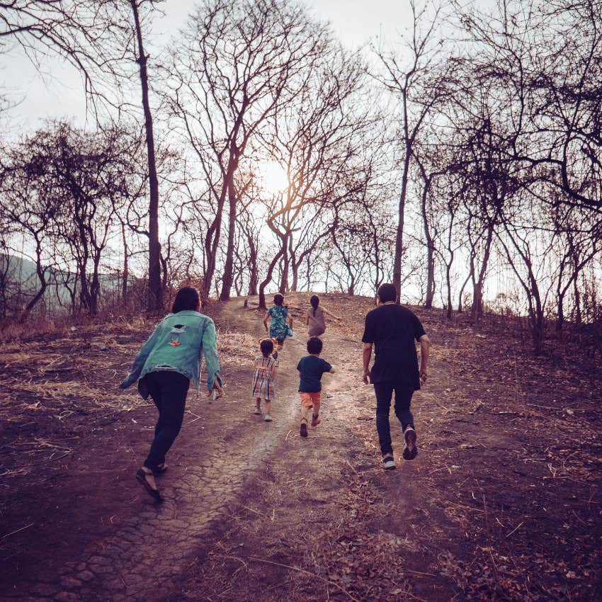 adults and kids walking on trails