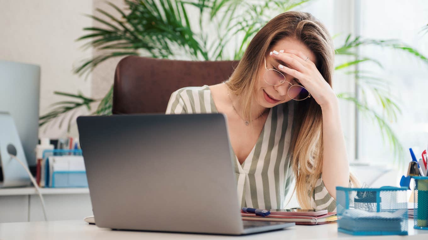 Autistic worker looking upset while on an online meeting. 