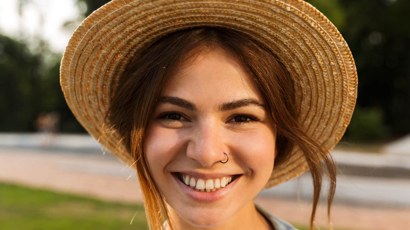 smiling happy woman wearing a hat