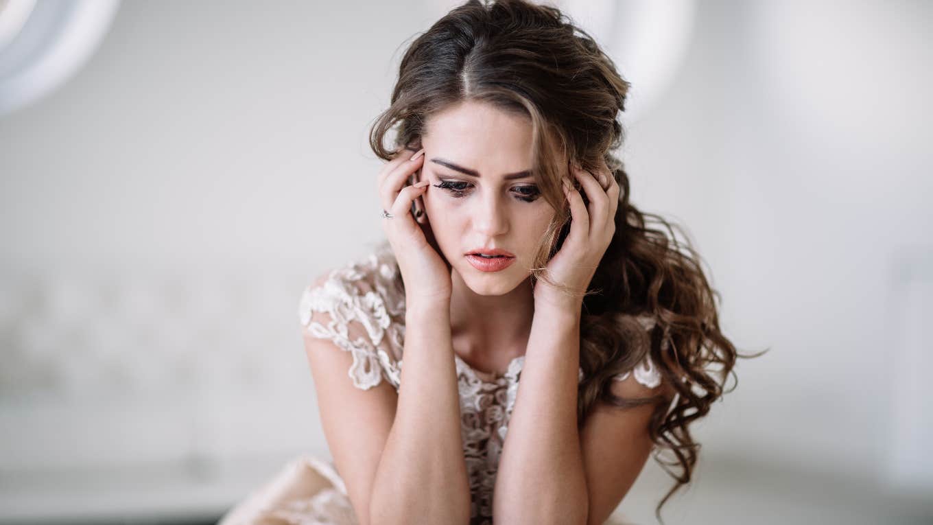 bride crying in wedding dress