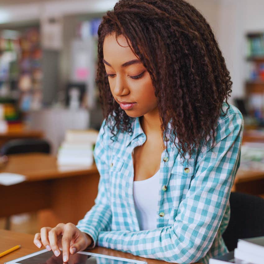 college student studying in library