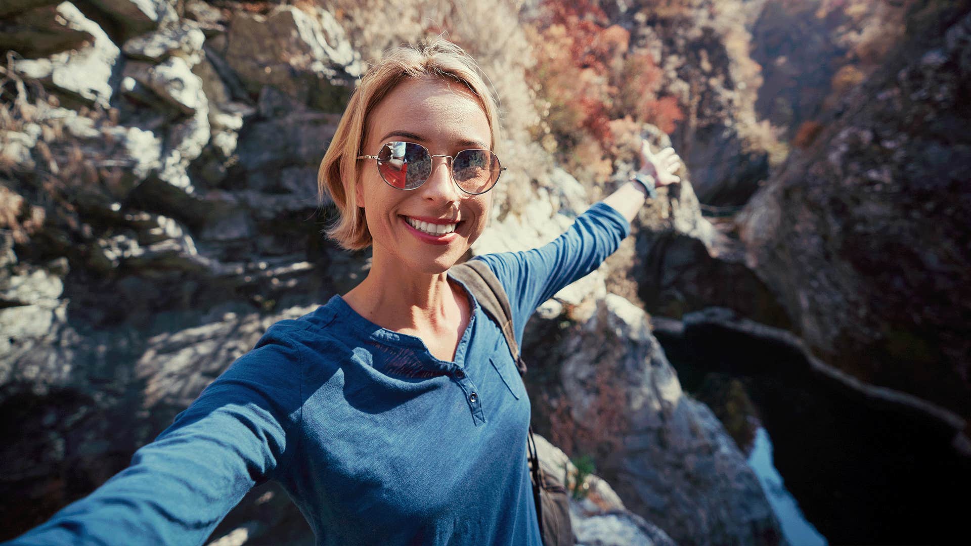 happy woman taking a selfie outdoors