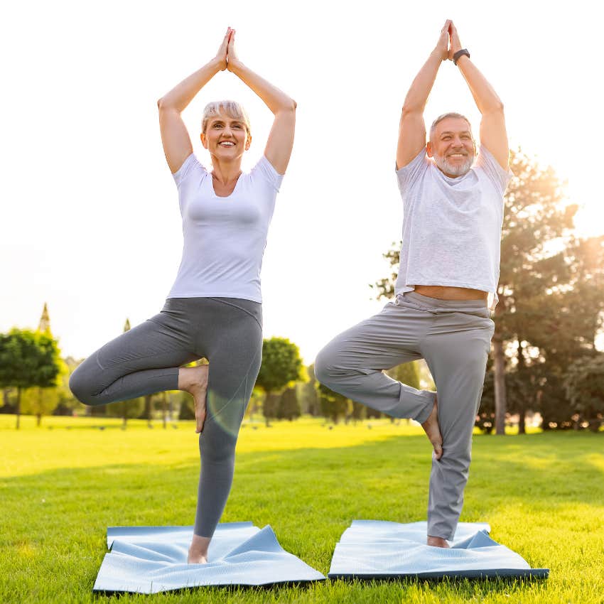 Couple working out together doing yoga.