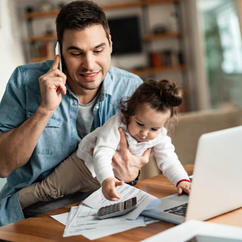 man working from home with baby 