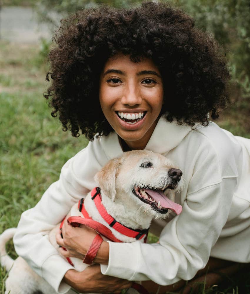 woman hugging a dog 