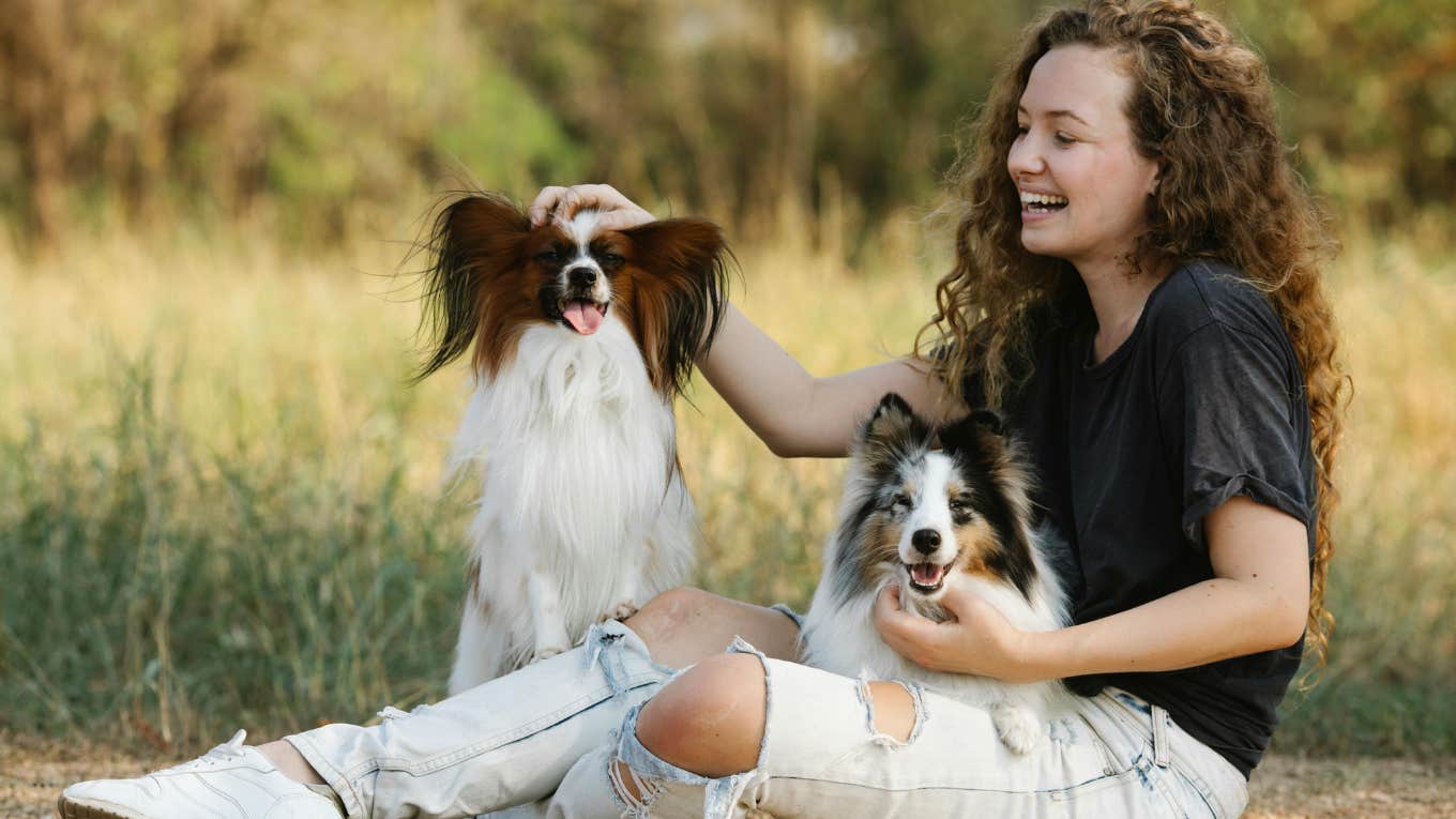 woman with two dogs