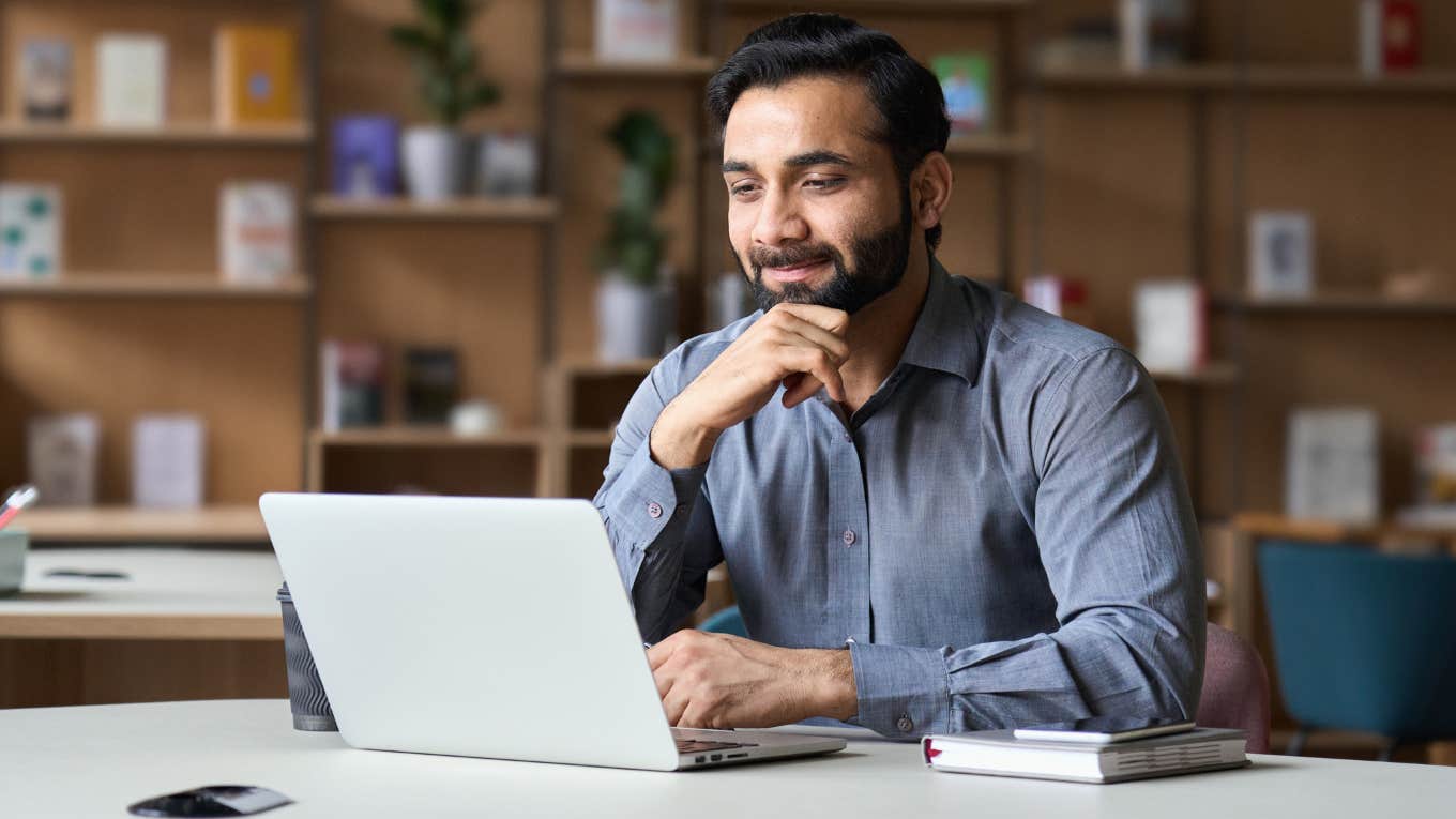 Salaried worker sitting at his desk. 