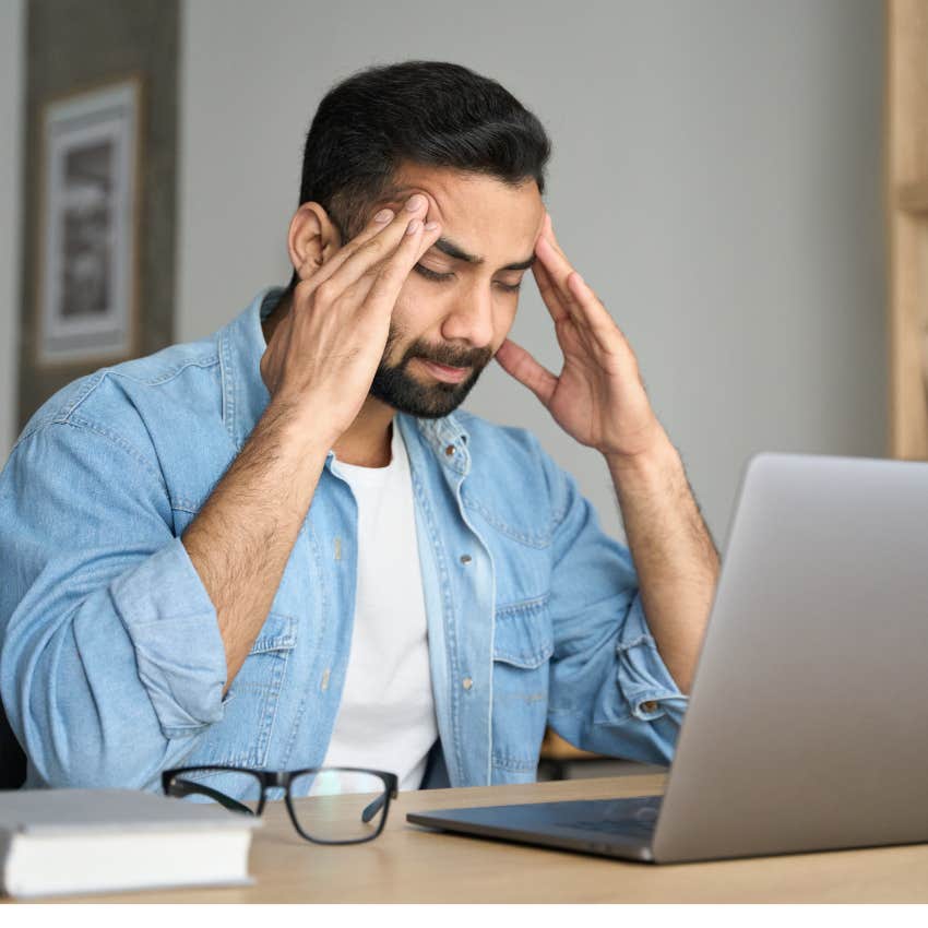 Exhausted employee frustrated after speaking with micromanaging boss. 