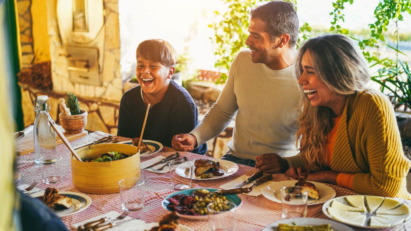 family having fun eating together during home dinner 