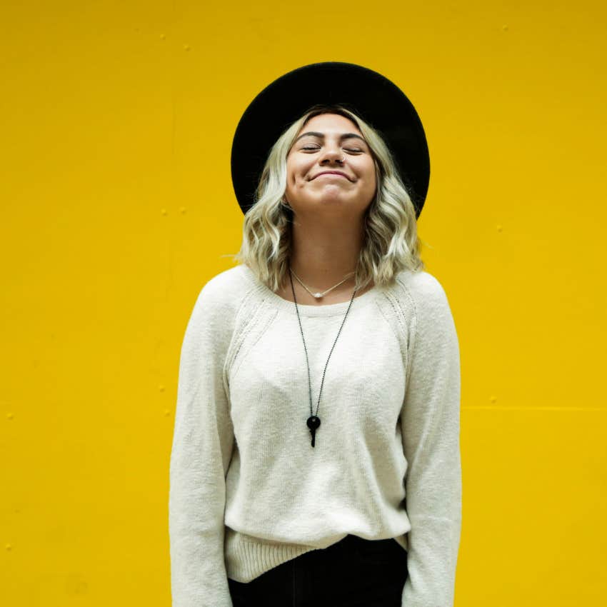 woman wearing hat smiling