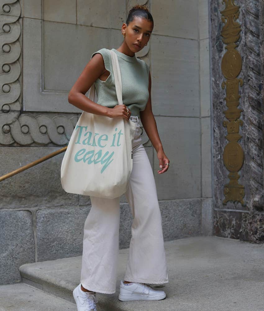 woman holding tote bag