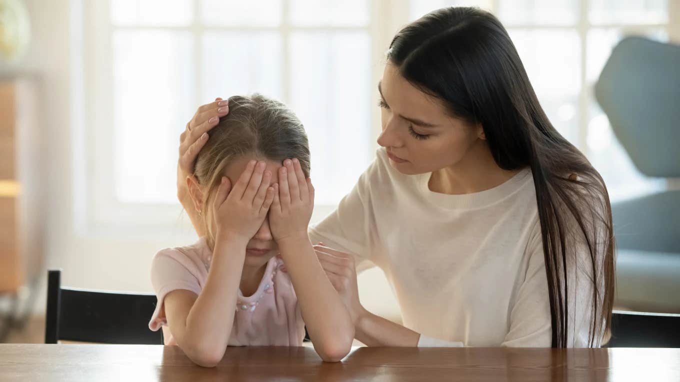 Gentle parenting mother comforting her daughter