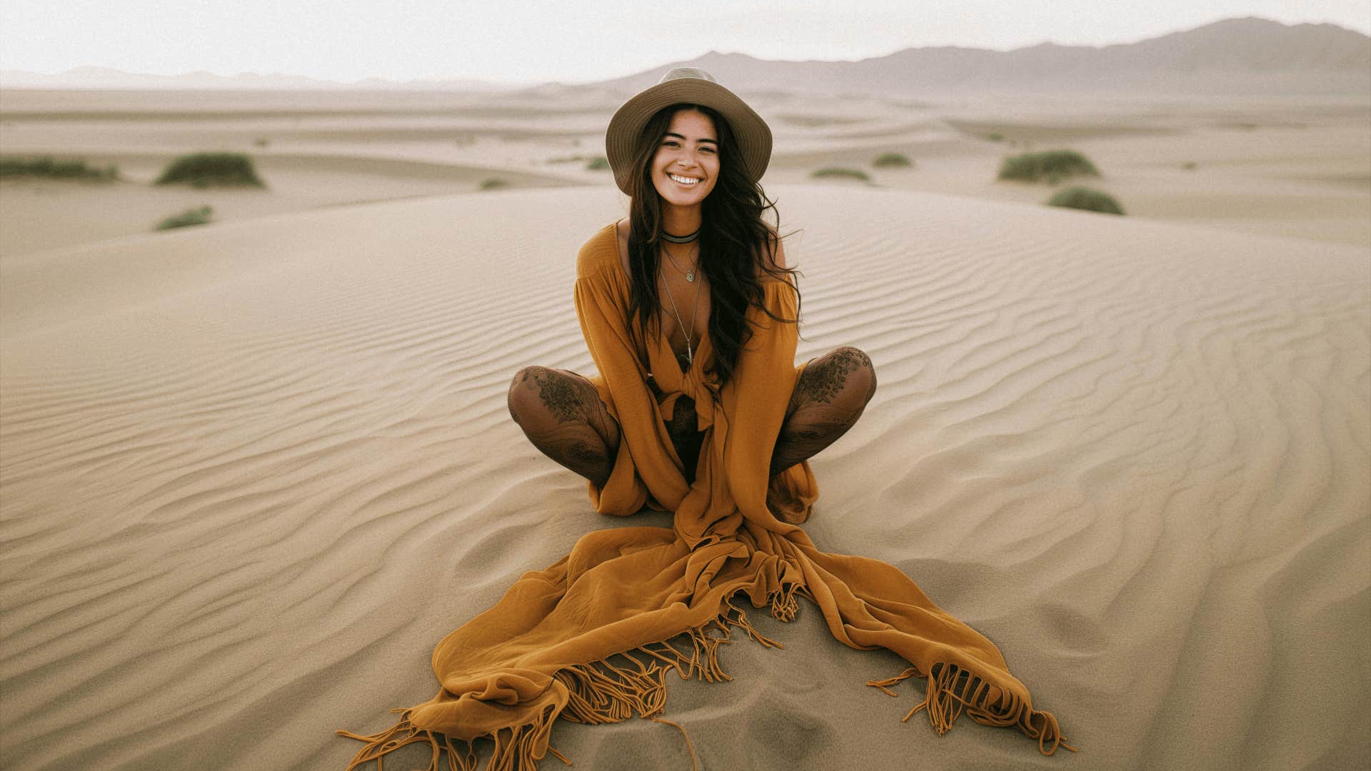 smiling woman in the sand