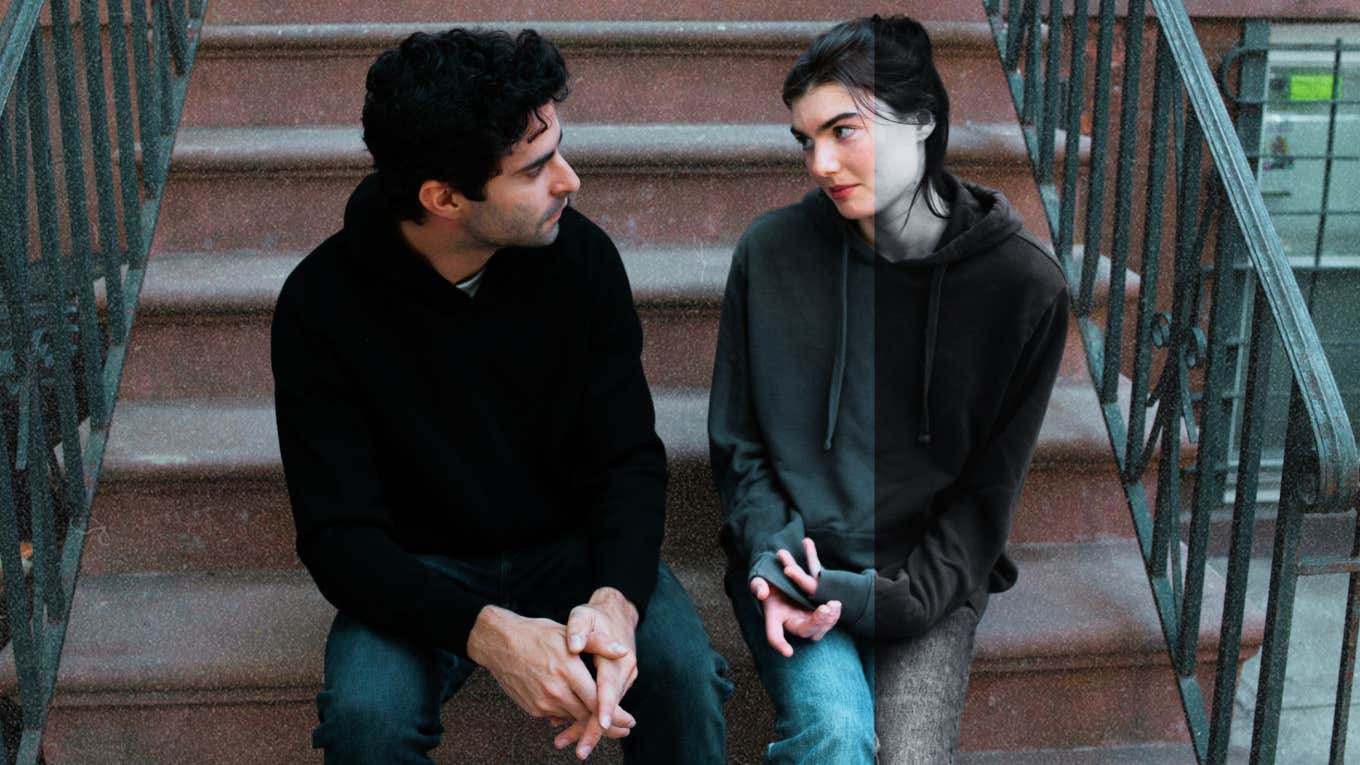 Woman with BPD sitting with a date on a staircase outside 