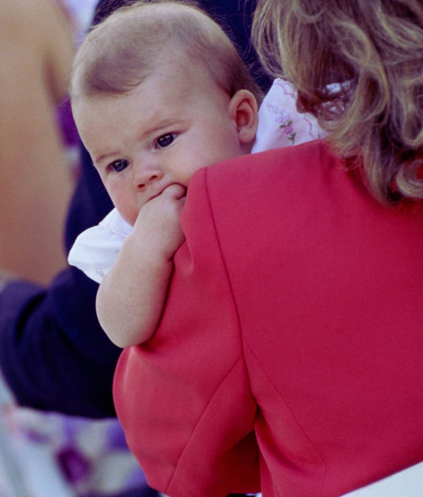 infant at a wedding