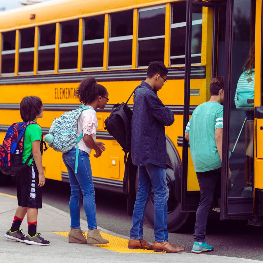 kids getting on a school bus