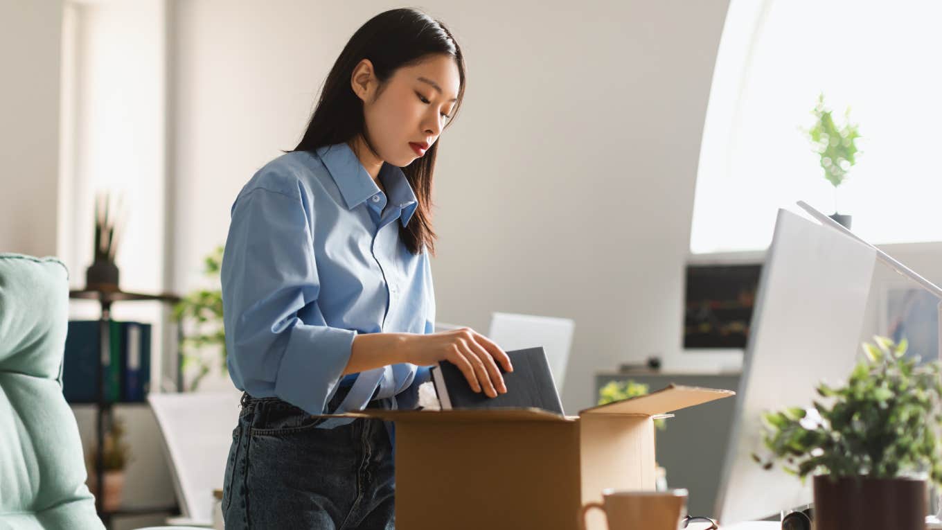 employee packing up office after resigning from job