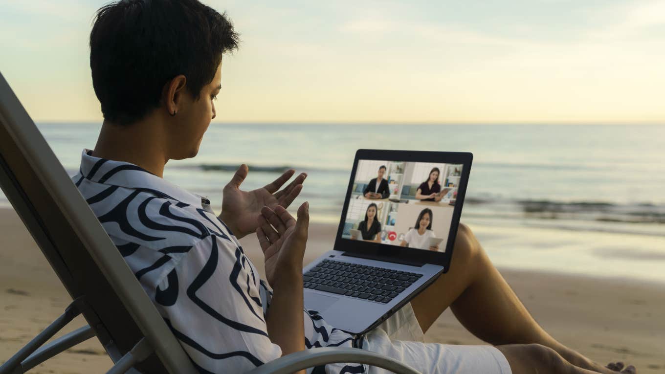 Employee working with on vacation PTO at the beach. 