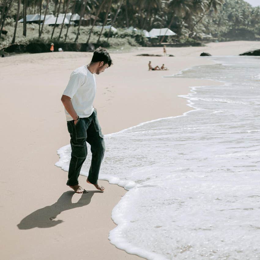 man walking on the beach alone