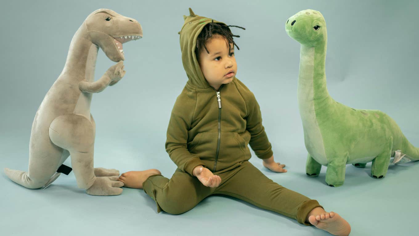 little boy dressed as a dinosaur