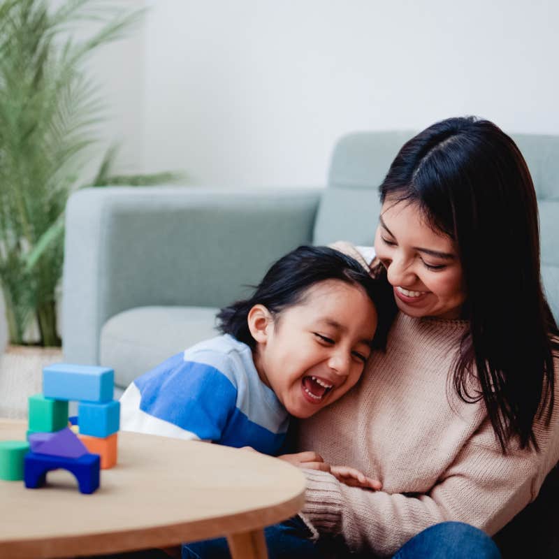 mother and son having fun playing together at home