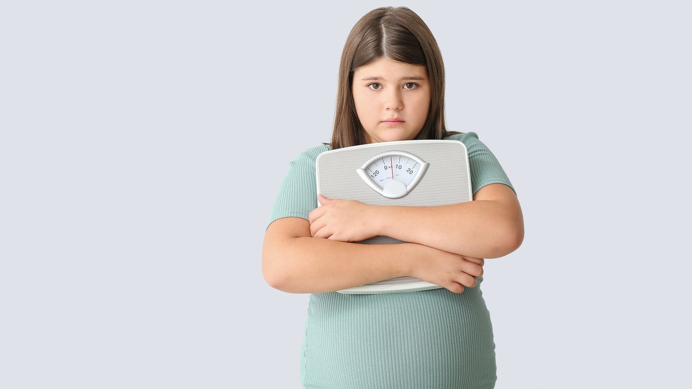 young girl worried about her weight