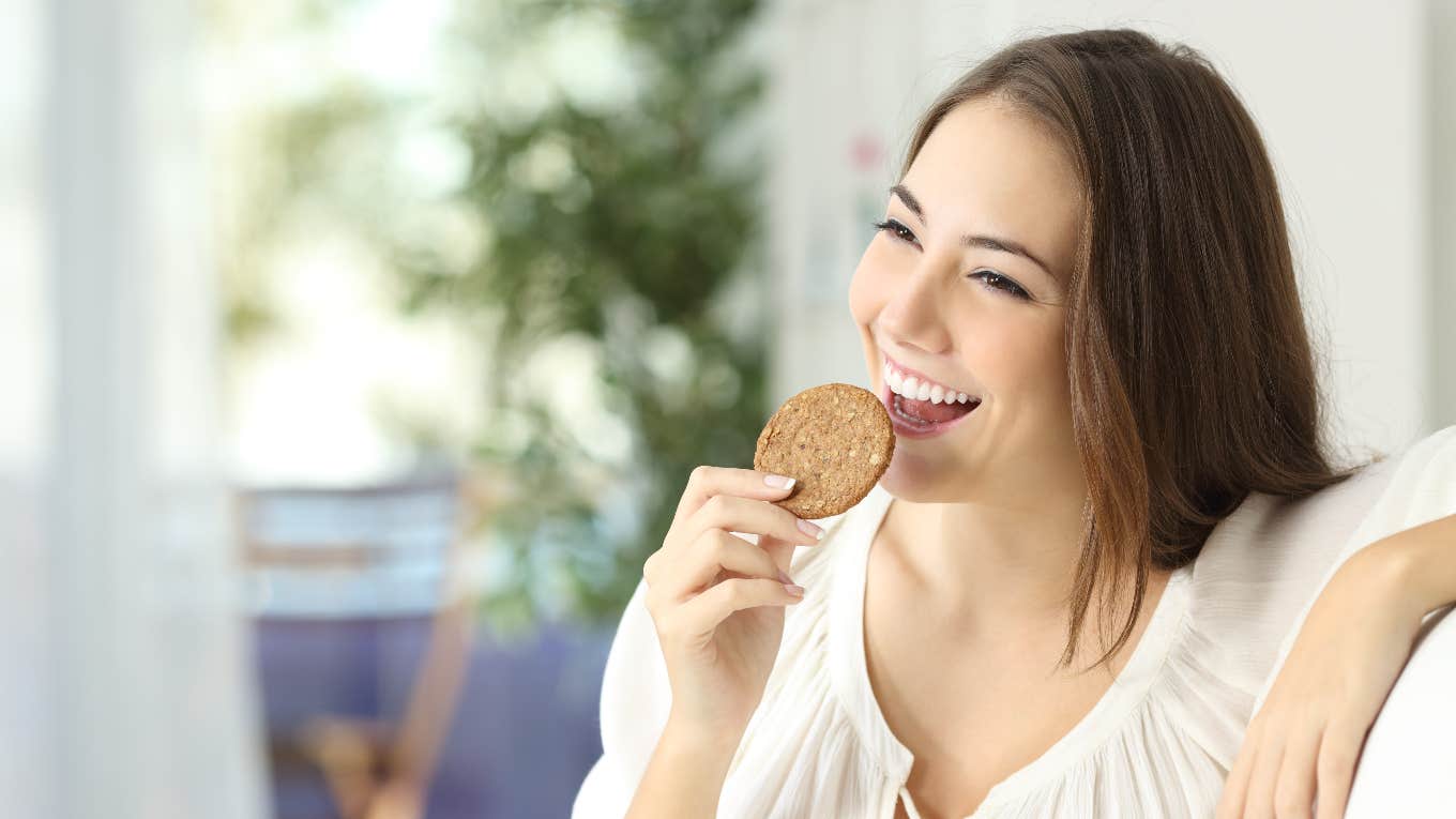 Woman eating a cookie