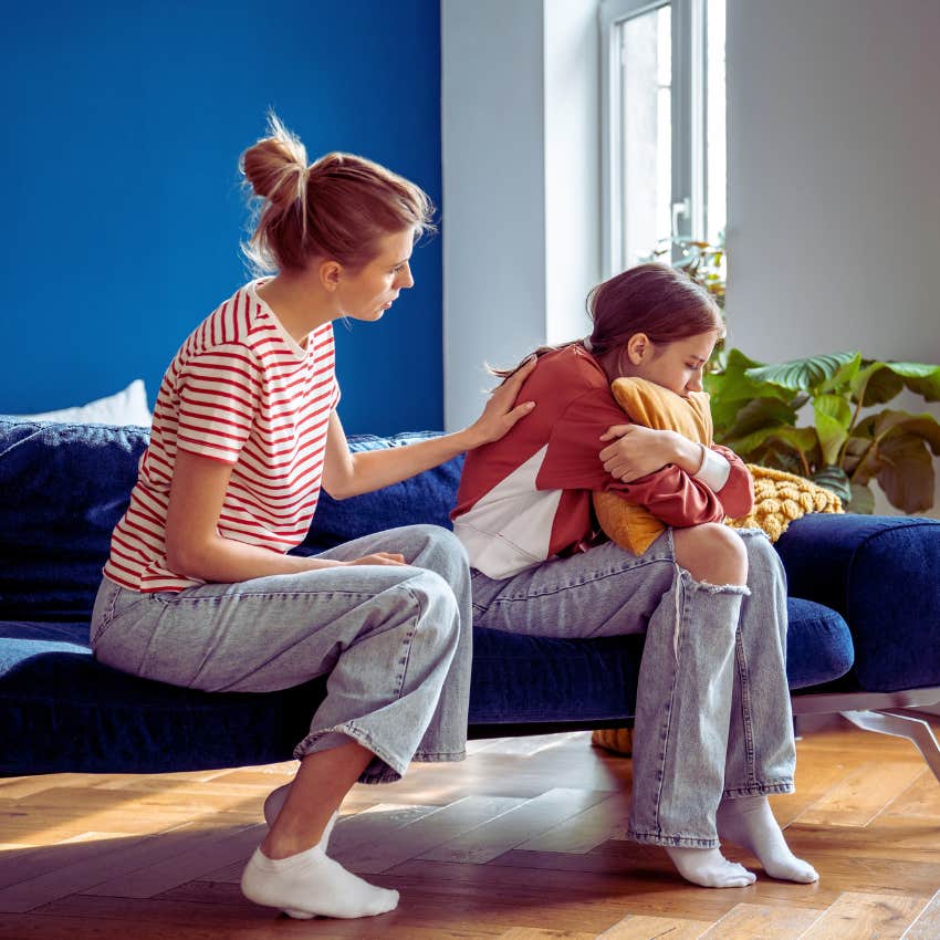 mom consoling upset daughter