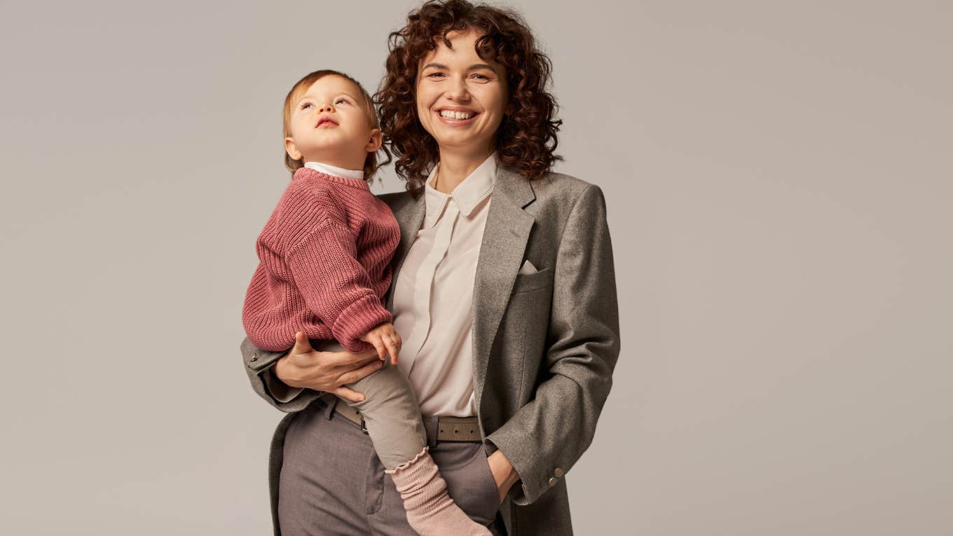 Woman holding her baby before a job interview. 