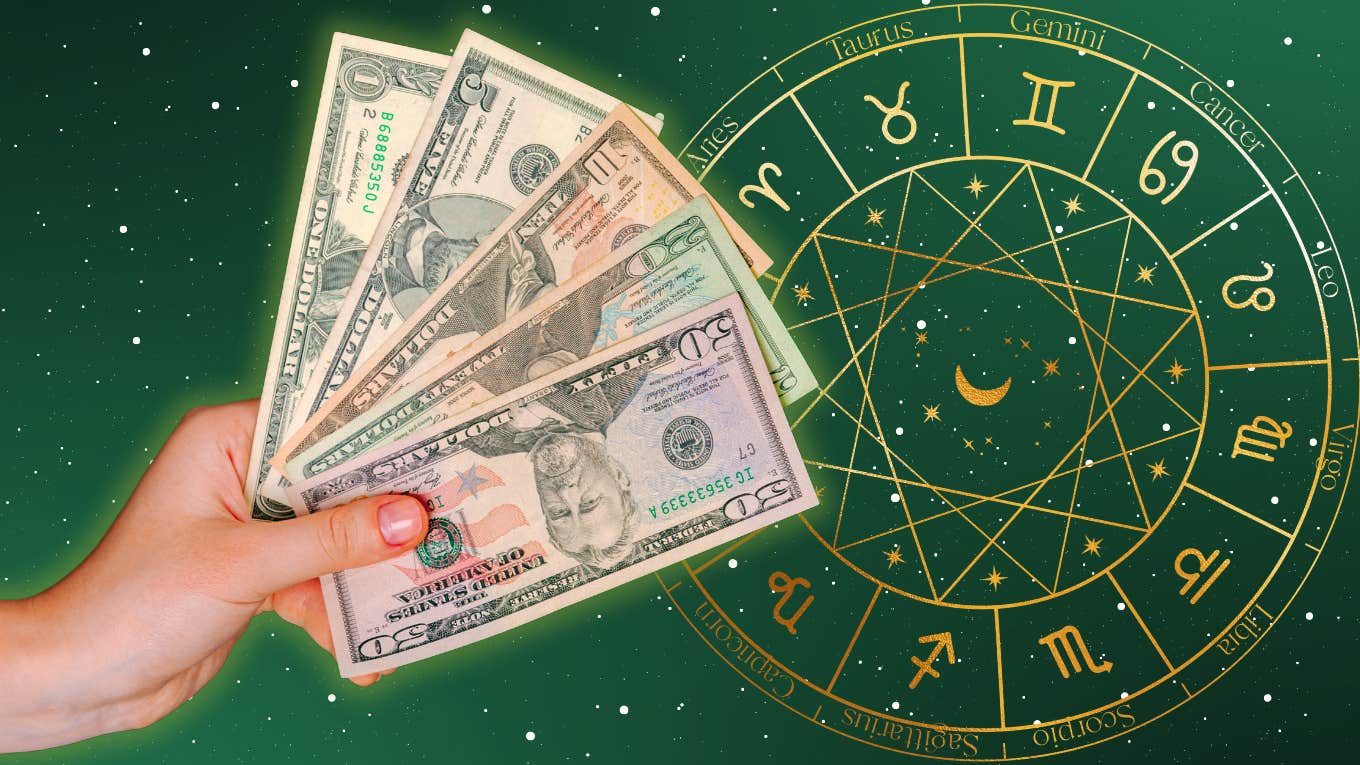 hand with money on zodiac wheel