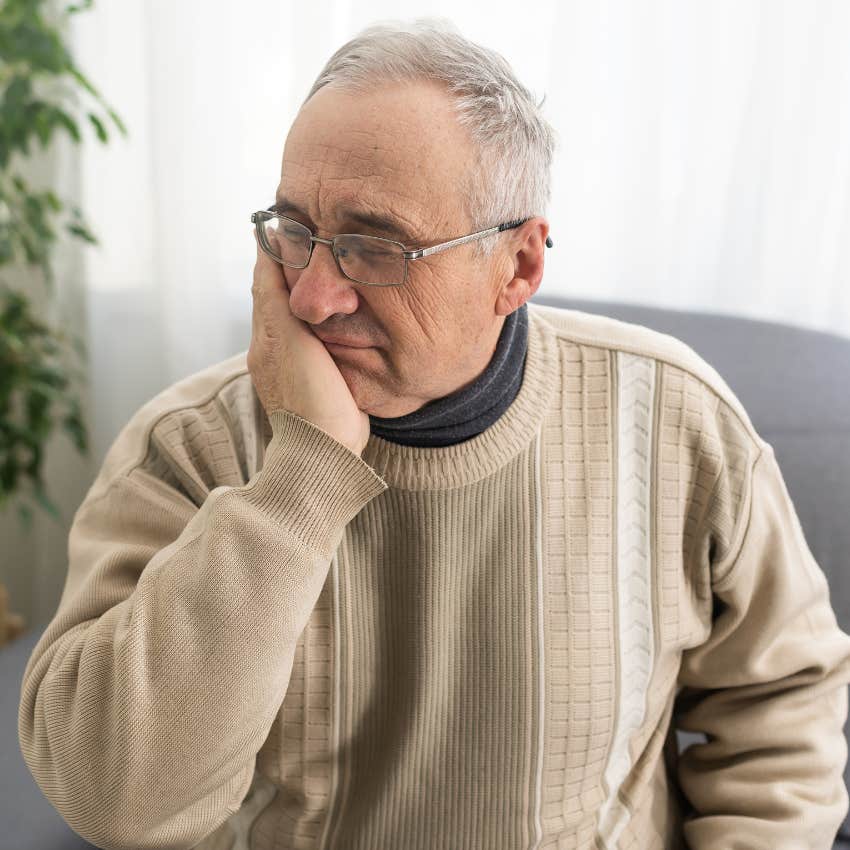 Older man looking sad while thinking about his no contact daughter.