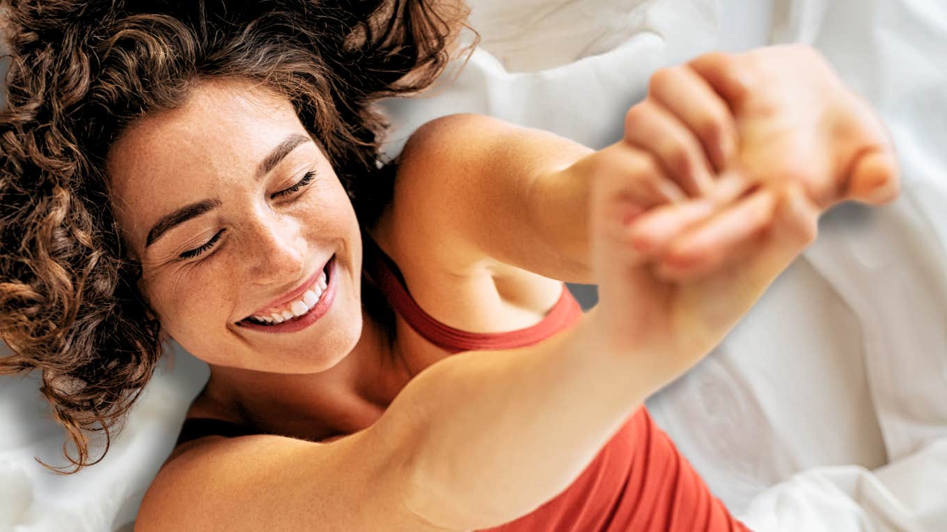 Woman stretching, feeling confident after a one night stand 