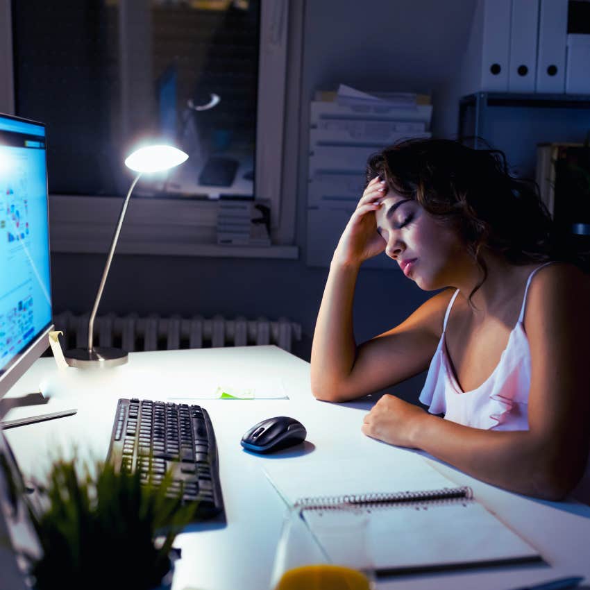 overworked woman falling asleep at her desk