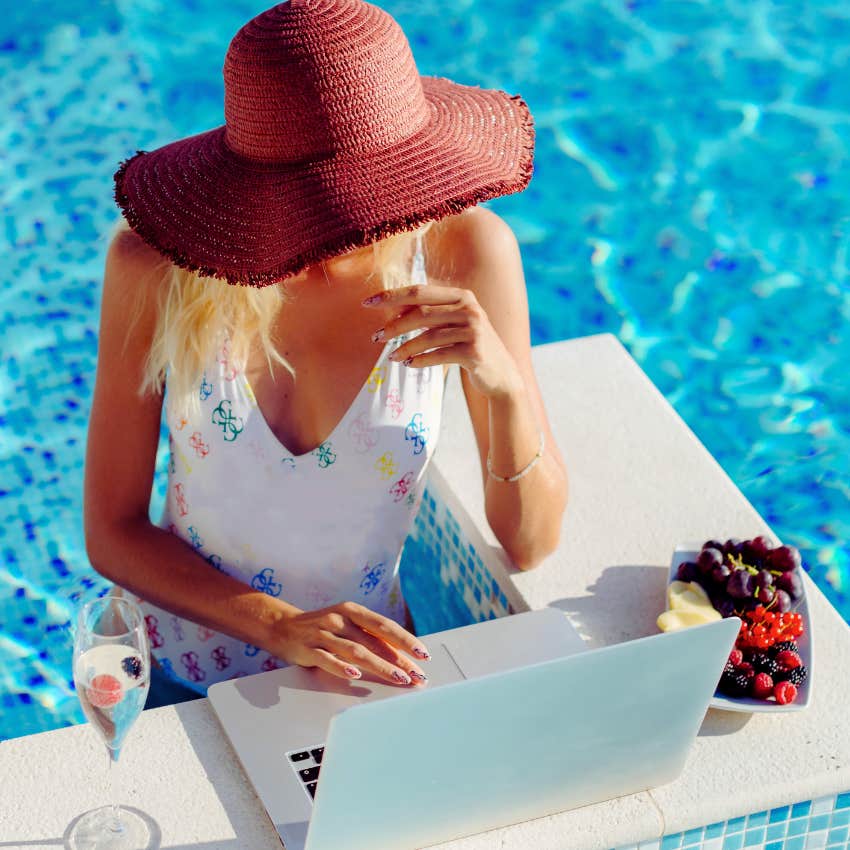 remote worker on laptop poolside