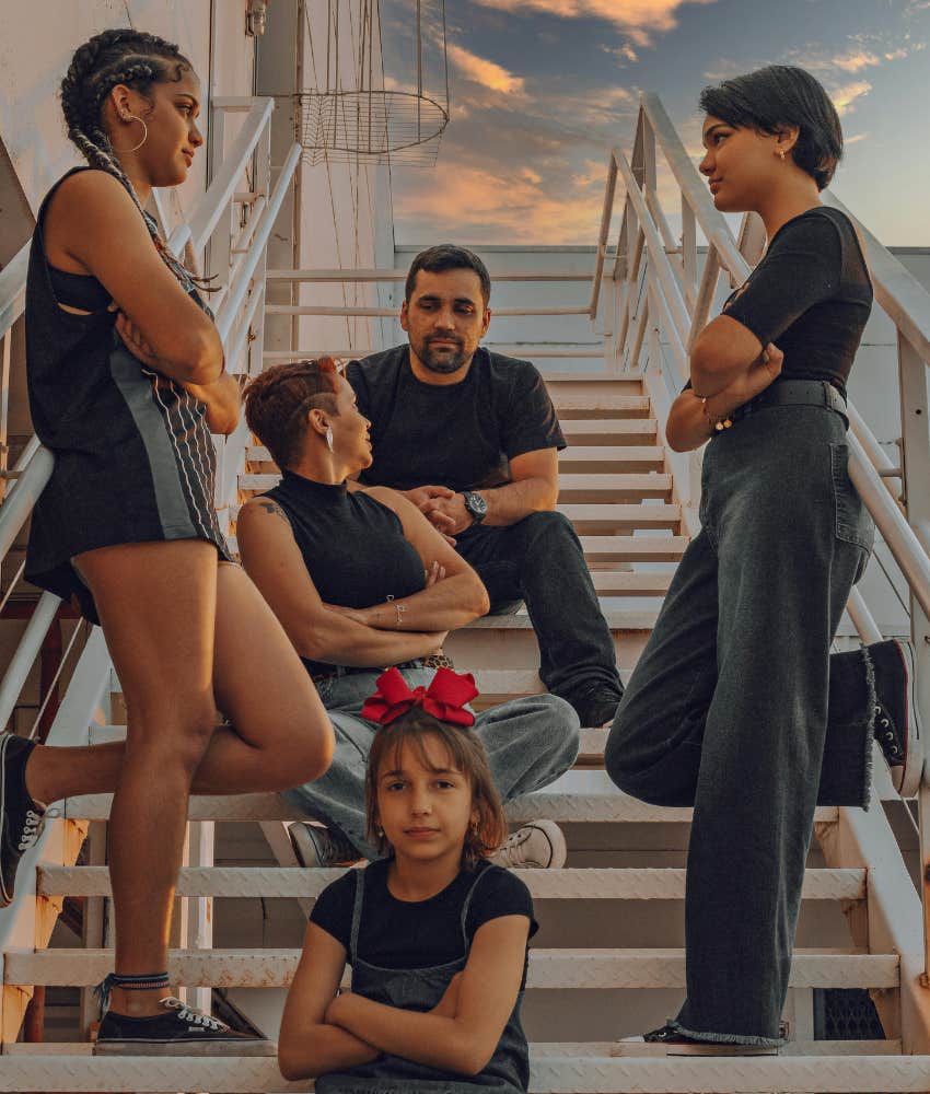 family sitting on stairs together