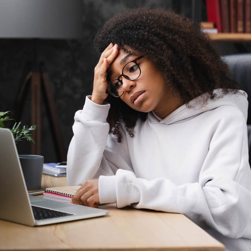 Teenage girl looking stressed over money and bills. 