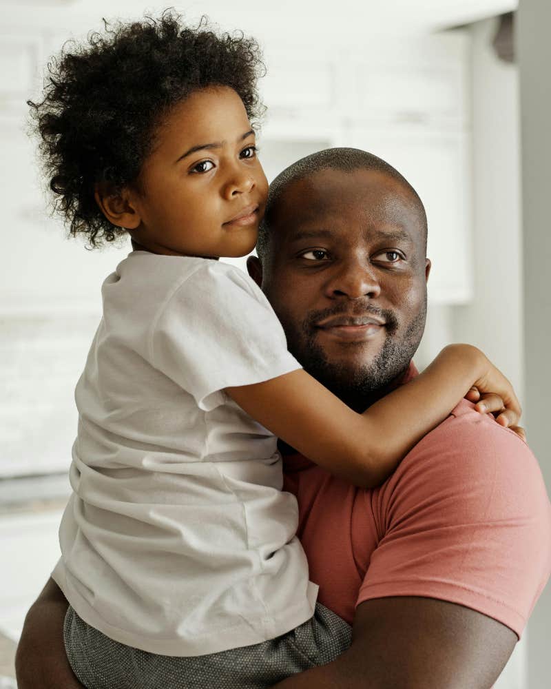 son and father hugging