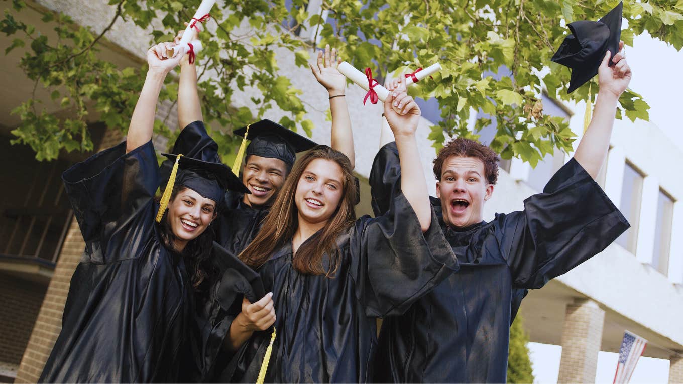 group of high school students celebrating at graduation