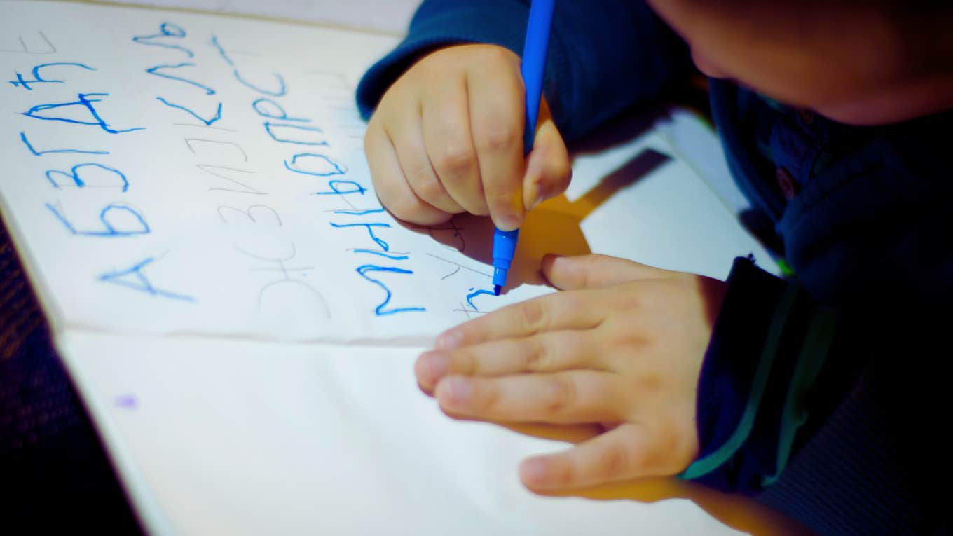 child learning how to write