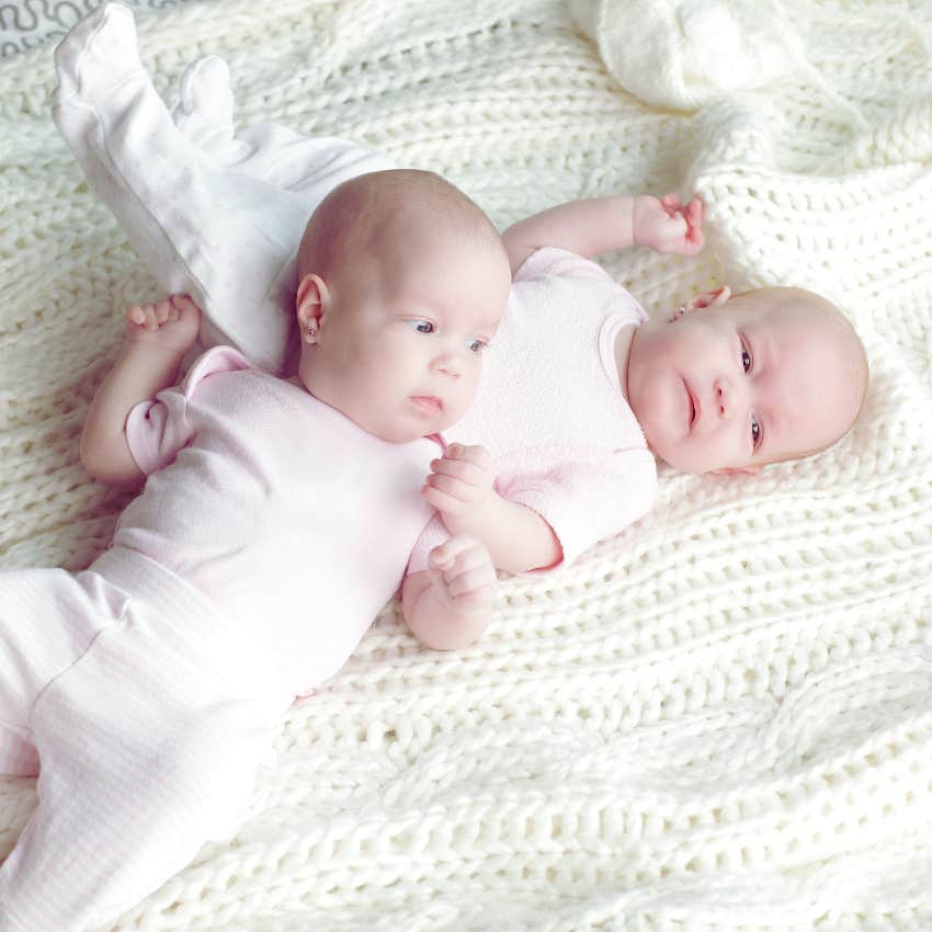 twin baby girls snuggling