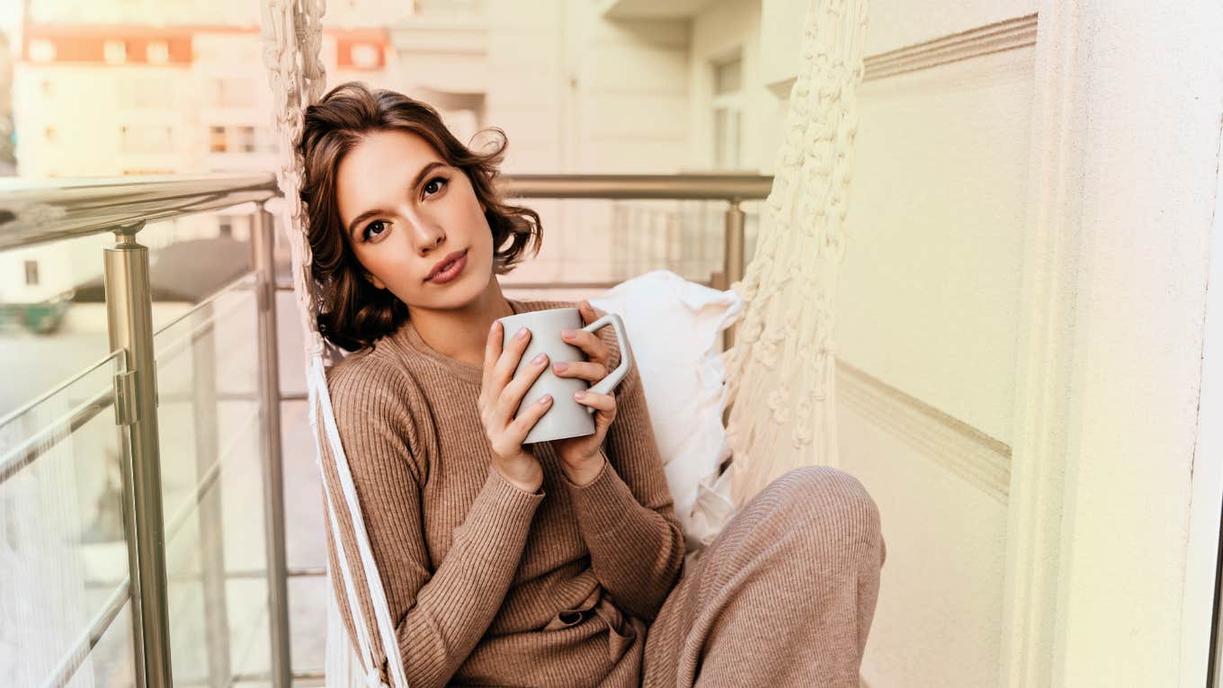Woman starting her day with gratitude, to attract love