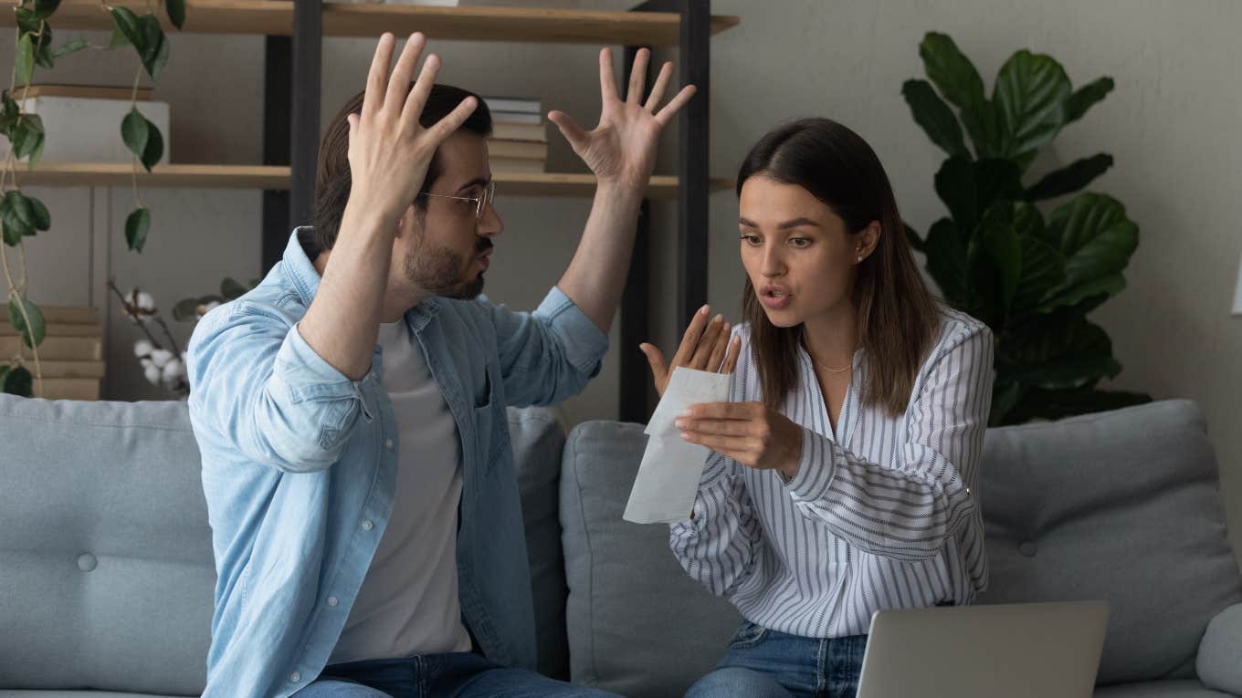 husband and wife arguing with receipt and laptop