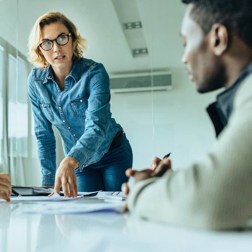 woman addressing co-worker during a meeting