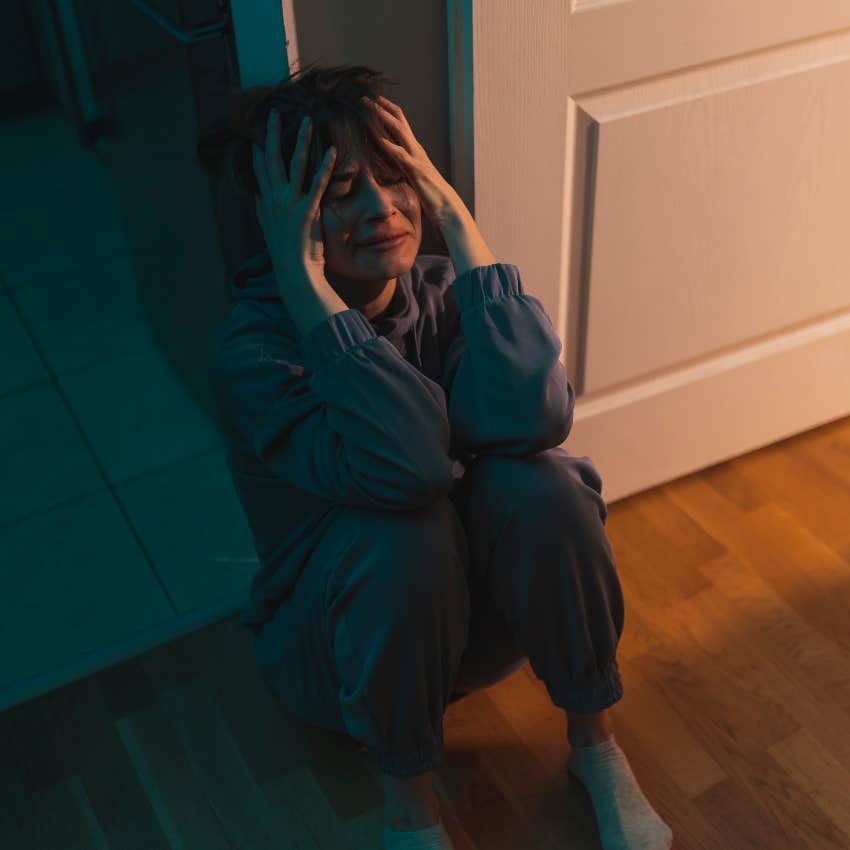 Woman crying on the floor